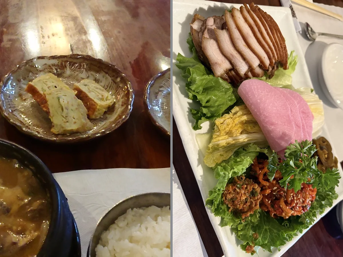 Plates of traditional Korean dishes on a dining table.