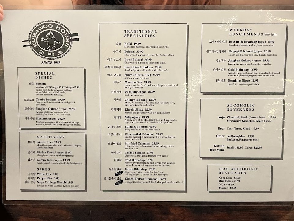 Printed menu with Korean specialties and appetizers.