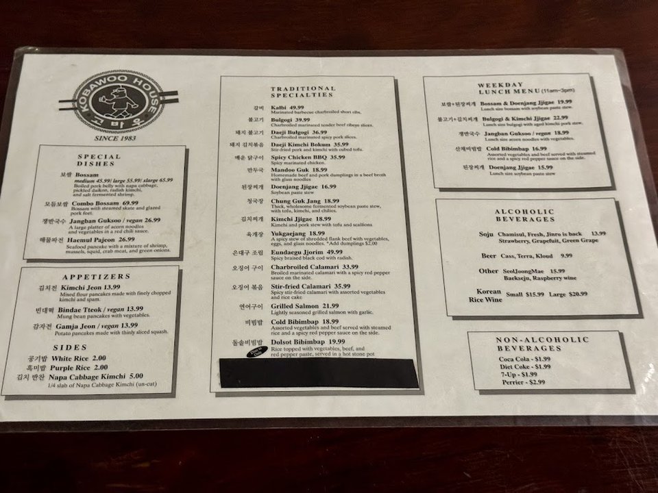 Restaurant menu with drinks, sides, and main dishes.